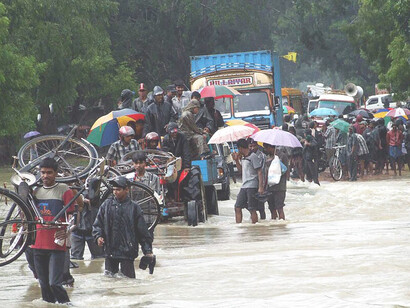 Monsoon flooding in the Vanni in November 2008 in Sri Lanka showing flooded streets and heavy rains that intensified the disaster