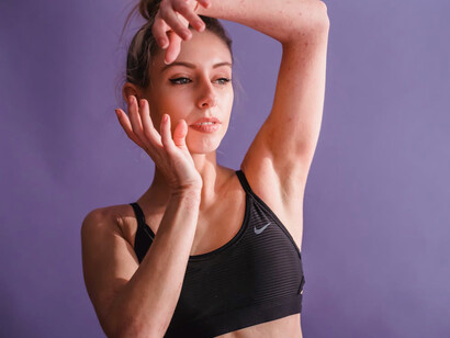 With arms raised high, she's celebrating the joy of movement, knowing that exercise is a powerful way to boost mood and enhance mental health