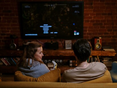 A joyful couple laughing and connecting over their favorite video game