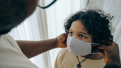 Children taking off the protective mask from the COVID virus even in the aftermath
