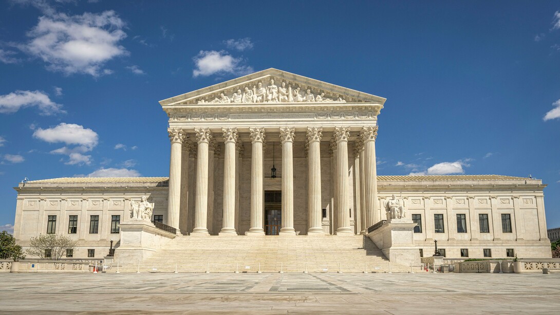 The U.S. Supreme Court building serving as a pillar of justice, reflecting the stability and legitimacy of a well-ordered legal system