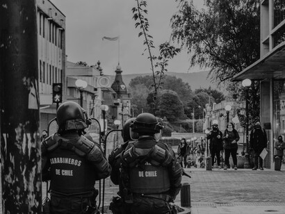 Chilean police overlooking a street