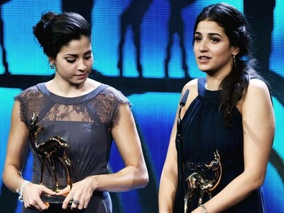 Yusra and Sara Mardini (right) are seen on stage at the 2016 Bambi Awards in Berlin, Germany
