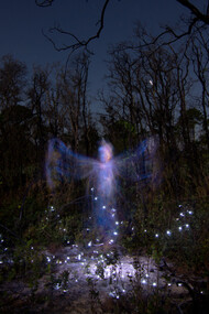 An apparition surrounded by energy and lights