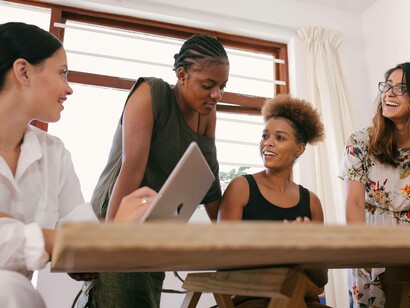 A group of women meeting to plan their path to their success
