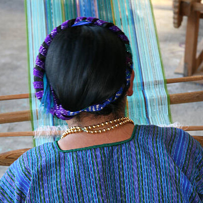 Traditional Mayan weaving in progress by a skilled artisan near Lake Atitlán, Guatemala, reflecting the rich cultural heritage of the region