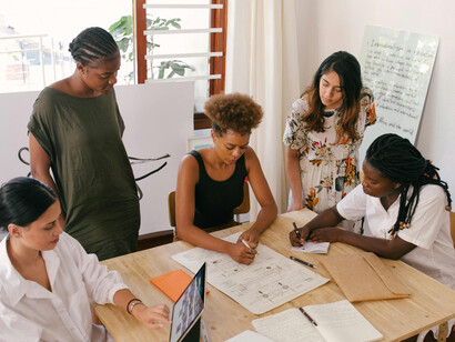 A group of women analyzing information in a meeting