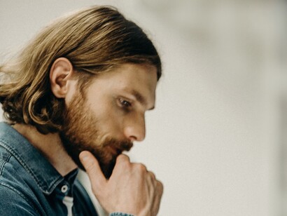 A man standing and thinking. A man’s choice begins with his thoughts, gets converted into speech, and later into action