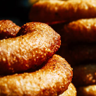 Sel roti is a traditional rice bread from Nepal that is prepared with a fermented rice batter and fried into a ring