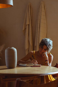 Lost in the rhythm of her thoughts, she weaves verses that dance from pen to paper, capturing the soulful whispers of her poetry
