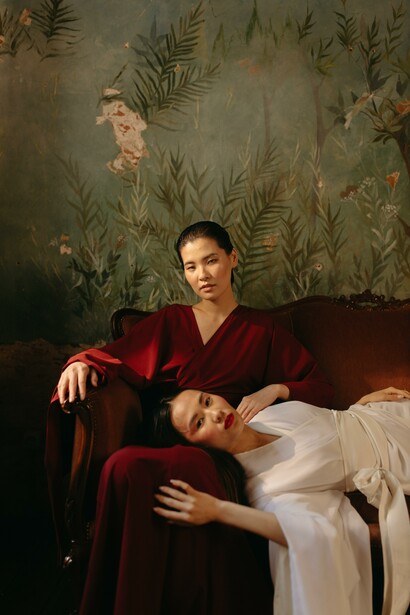 Two woman sitting on a sofa 