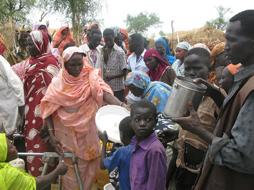 Refugees queue to collect water at Jamam camp in South Sudan