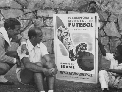 World Cup 1950: fans look at the official World Cup poster