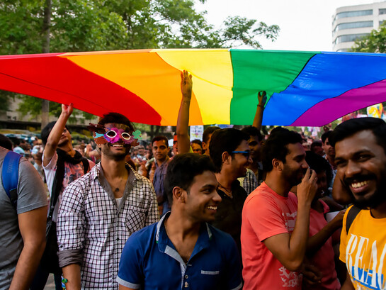Members and supporters of the lesbian, gay, bisexual, and transgender community, some wearing masks, participate in a Pride March rally in Bangalore, India, on Sunday, November 22, 2015