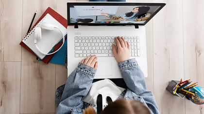 Experience the education as a child participates in online lessons, demonstrating the seamless integration of technology in learning