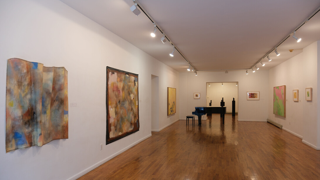 Ashley Cole (left to right)  Bellows, From Accordion Folds, Mixed Media, 2023; Round Midnight, Mixed Media, 2023, Cynthia Hawkins; Untitled 1989; Untitled #1,Monotype (Right Wall), Cynthia Hawkins; Untitled 1997,Watercolor, Cynthia Hawkins; Untitled, 1988 Acrylic on Canvas; Yellow Acorn, 2002, Casein and Ink