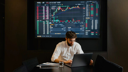 A data analyst dives deep into the intricacies of the tech stack, using real-time graphs to translate raw data into actionable insights for strategic decision-making