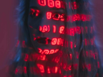 A woman hypnotized by the AI binary code