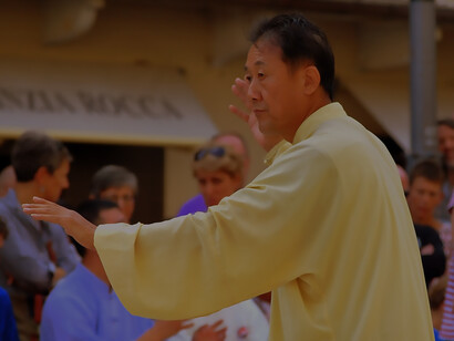 A Chinese individual engaging in the practice of Qigong for wellness