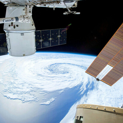 Earth seen from space, captured from an orbiting satellite, showcasing the planet’s atmosphere and technological presence in low Earth orbit