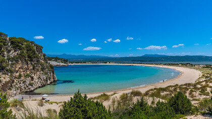 The blue Mediterranean bay of the Peloponnese in Greece is the perfect summer beach destination