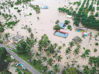 The dramatic essence of flooding in Kijal, Terengganu, Malaysia, through evocative imagery that reveals the impact of rising waters on the landscape