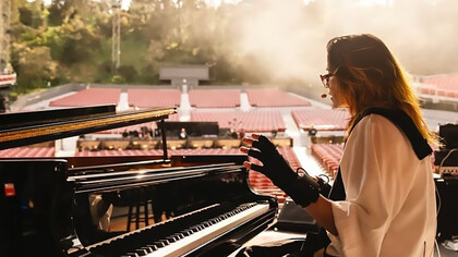 Imogen Heap soundchecking Mi.Mu Gloves effects with the grand piano for a live improvisation
