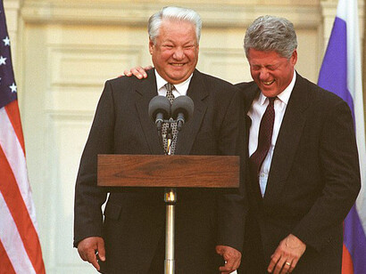 President Bill Clinton breaks up laughing at a comment President Boris Yeltsin of Russia makes about the press during a press conference at the Franklin D. Roosevelt Library in Hyde Park, NY