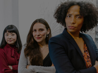 A group of businesswomen posing for a photo