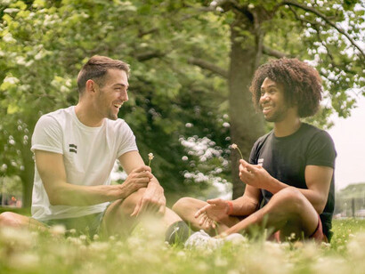 Enjoying a moment of levity, they brainstorm ideas that blend friendship with the promise of business success