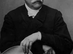 Portrait of Otto von Bismarck, the first Chancellor of the German Empire, standing with a hat and walking stick. A dominant figure in 19th-century European politics, Bismarck played a central role in German unification and helped shape the continent's balance of power before World War I