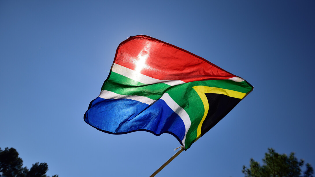 In the spirit of democracy, the South African flag stands tall, symbolising resilience amidst challenging times