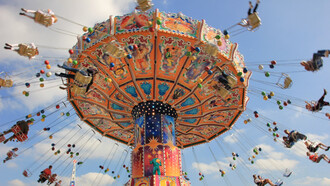 People riding a ride an at amusement park