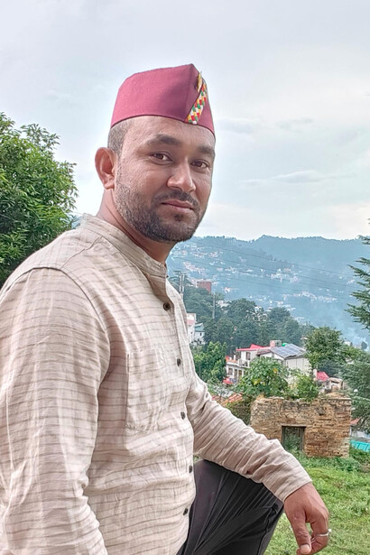 Kumaoni guy wearing the trademark cap Kumaoni Pahadi Topi, which is a symbol of pride