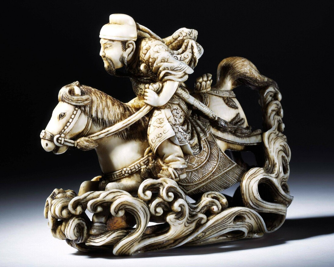 Netsuke of the Chinese General Gentoku riding across a river, carved ivory, signed Rakueisai, ca. 1850 – 1900, Japan. Museum no. A.781-1910. © Victoria and Albert Museum, London