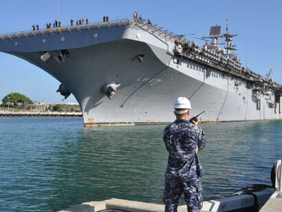 The USS Iwo Jima docks at Naval Station Guantanamo Bay, Cuba, for refueling and resupply. The ship has just completed the first phase of its humanitarian assistance operations in Haiti as part of Continuing Promise 2010—a four-month humanitarian and civic assistance mission across Latin America and the Caribbean