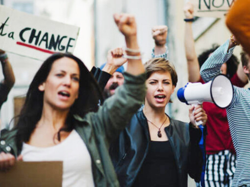 Protesters holding placards, demanding justice and advocating for human rights as part of a movement for change