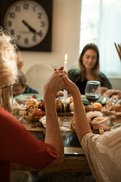 People eating together and showing gratitude for what they have 