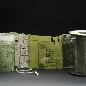 Yuko Kimura, Moss Spool Book no.3, 2012, etching on antique book pages from Japan, linen thread, wooden spool, 4 1/4 x 3 x 43 inches