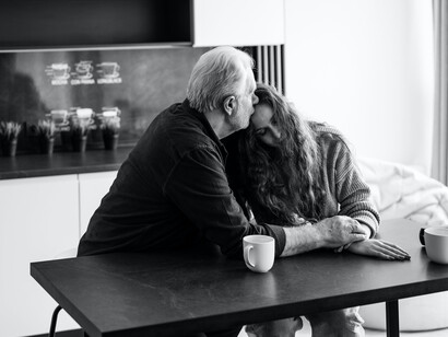 An elderly man and a woman expressing grief and sorrow