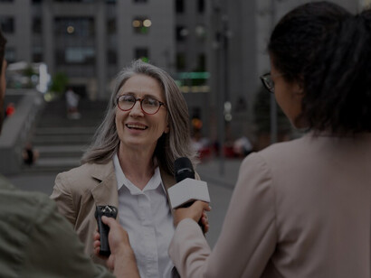 A team engaged in a journalism interview, showcasing collaborative reporting and communication skills