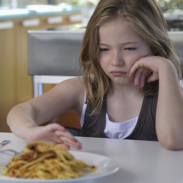 Child refusing food. Photo source: Altrendo Images/Getty Images