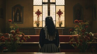 A lone figure facing the altar in silent prayer, reflecting the hope of renewal after spiritual decline