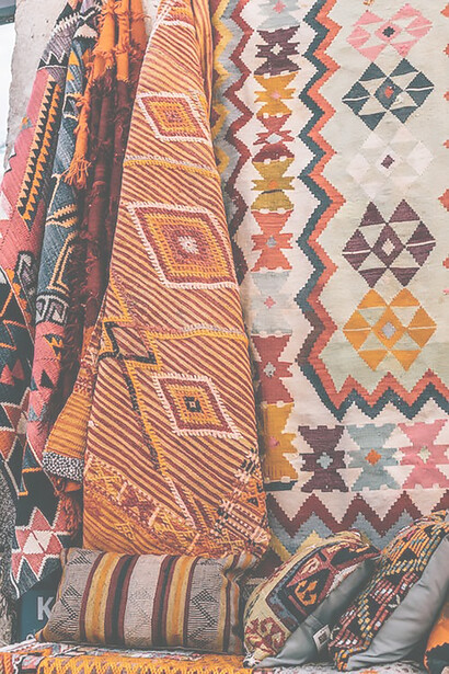 Rich Turkish carpets, meticulously crafted and sourced from Goreme National Park in Nevsehir, Turkey, exemplify the timeless allure of Orientalism with their intricate patterns and vibrant hues