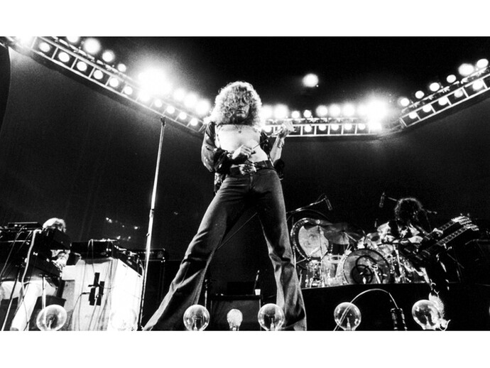 Singer Robert Plant of Led Zeppelin performing on stage at Earl’s Court in London in May 1975
© Michael Putland, Courtesy of Proud Galleries