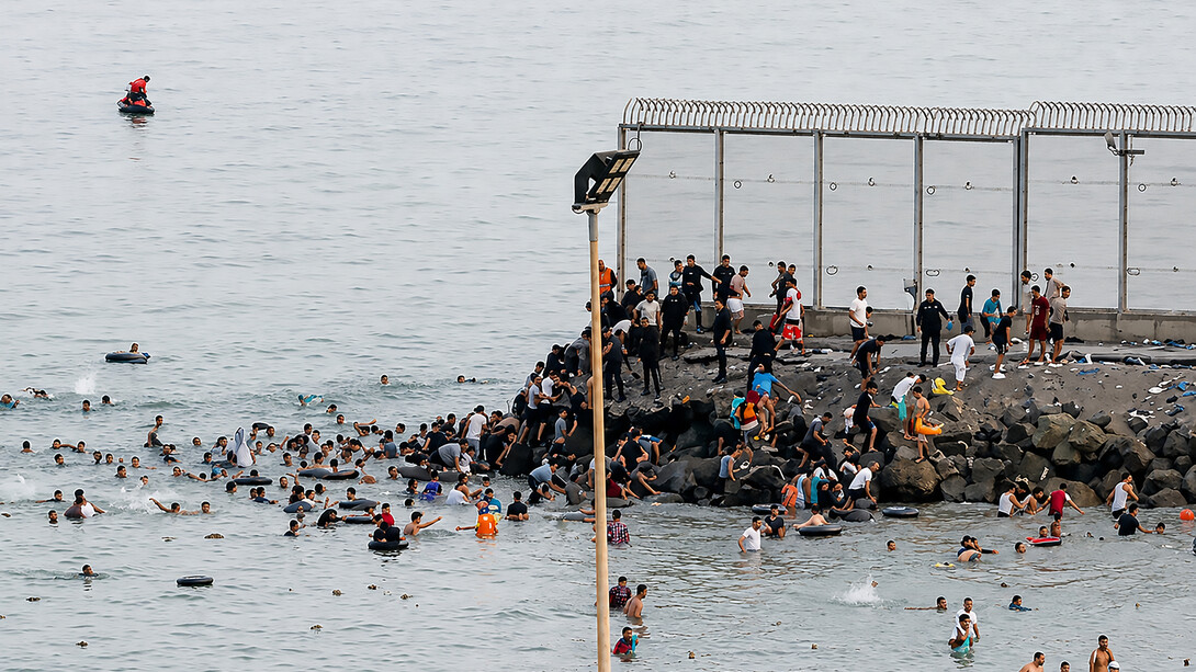 An estimated 60,000 people crossed from Morocco into Ceuta, overwhelming local authorities and triggering a humanitarian and border security crisis