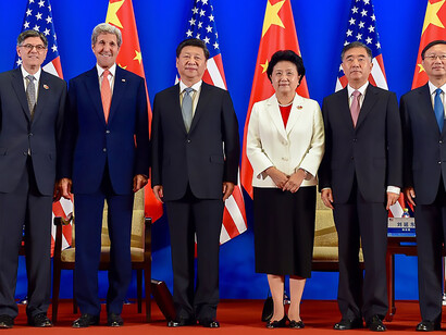 U.S. Treasury Secretary Jack Lew and U.S. Secretary of State John Kerry pose with Chinese President Xi Jinping, Chinese Vice Premier Liu Yandong, Chinese Vice Premier Wang Yang, and Chinese State Councilor Yang Jiechi on June 6, 2016, in a villa at the Diaoyutai Guest House complex in Beijing, China