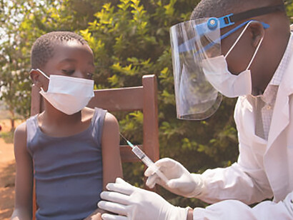 Experience an open-air vaccination session in an African village amidst the coronavirus pandemic, showcasing proactive measures and community resilience
