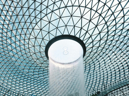 A close-up of the dome and waterfall of the Jewel Changi Airport, Changi, Singapore