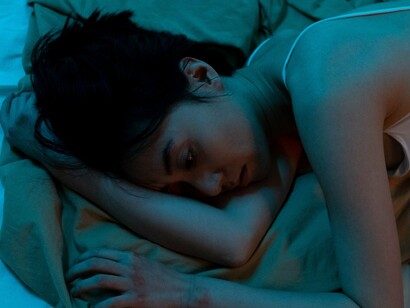 A woman going through the stages of grief after a breakup